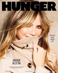 Heidi Klum wearing a beige trench coat with tortoise buttons for Hunger magazine styled by Ellie Witt