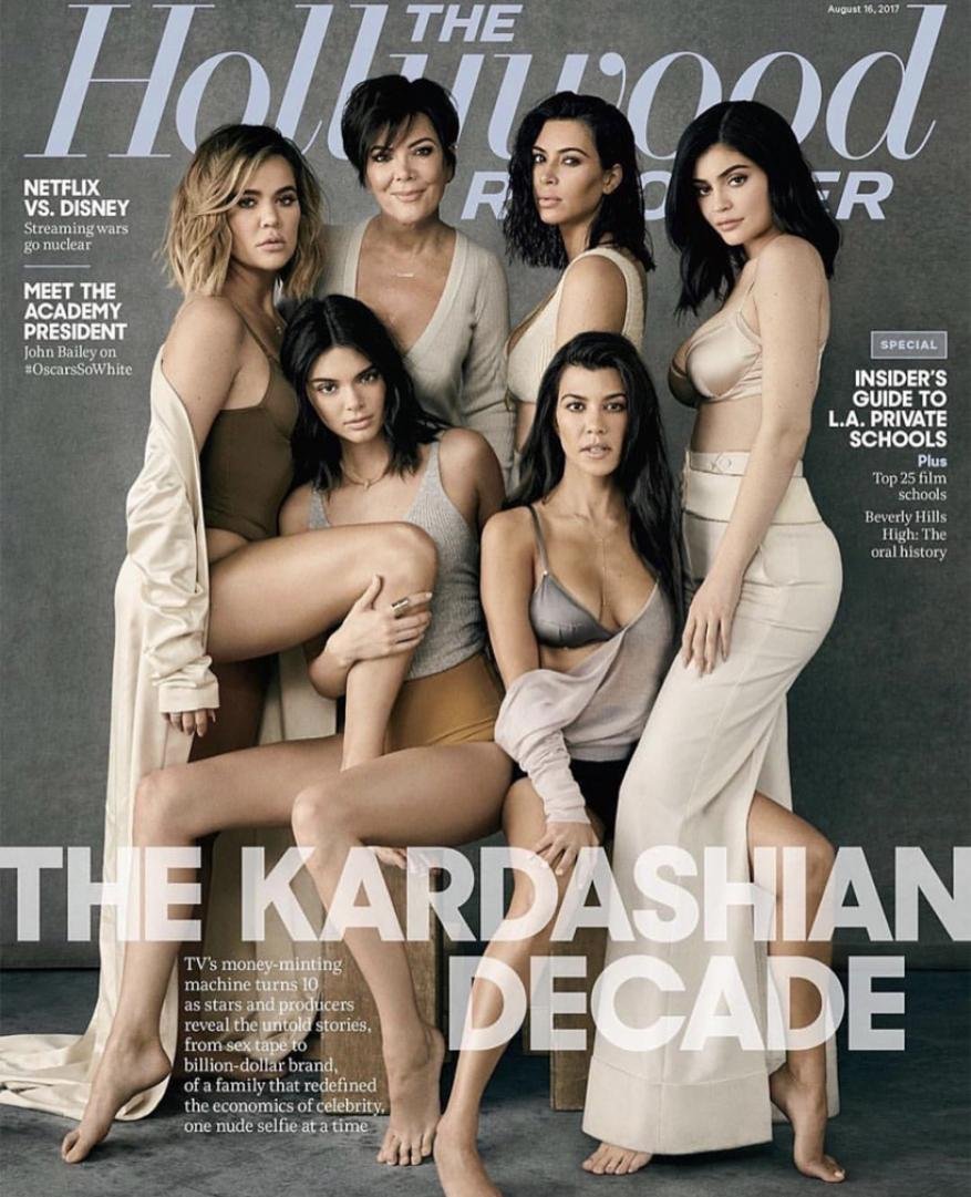 Magazine cover featuring Kris Jenner, Kim Kardashian, Khloe Kardashian, Kourtney Kardashian, Kendall Jenner, and Kylie Jenner posing indoors.