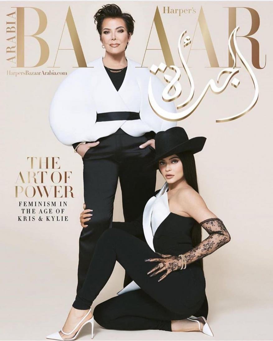 Harper's Bazaar cover featuring Kris Jenner and Kylie Jenner in black and white outfits with gold lettering and a light beige background.