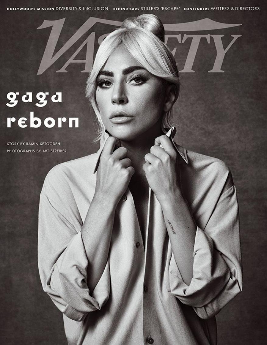 Black and white portrait of Lady Gaga on the cover of Variety Magazine. She wears an unbuttoned collared shirt with hair in a topknot.