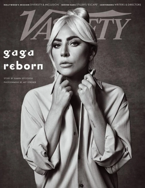 Black and white portrait of Lady Gaga on the cover of Variety Magazine. She wears an unbuttoned collared shirt with hair in a topknot.