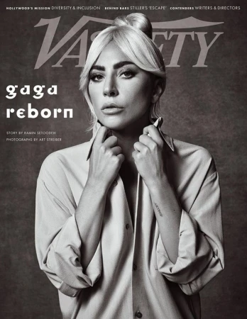 Black and white portrait of Lady Gaga on the cover of Variety Magazine. She wears an unbuttoned collared shirt with hair in a topknot.