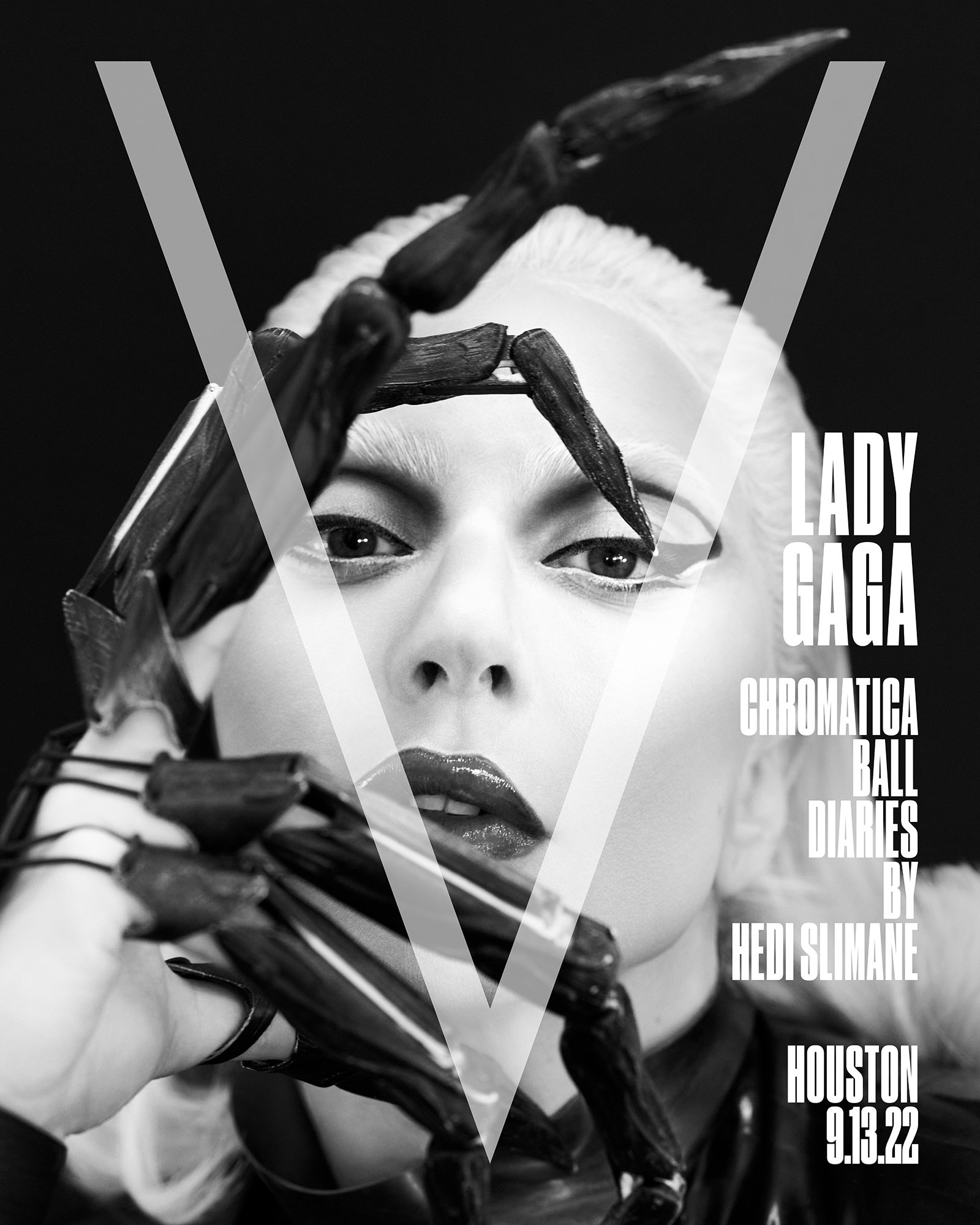 Black and white studio shot of Lady Gaga with platinum blonde hair and black spider-like headpiece, overlaid with transparent V logo.