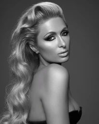 Portrait of Paris Hilton in profile with vintage Hollywood waves and dramatic eye makeup against a dark studio background