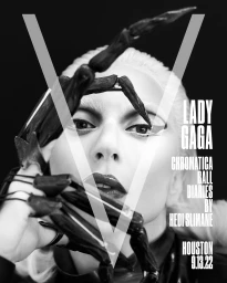 Black and white portrait of Lady Gaga with blonde hair and dark claw-like hand accessory near her face.