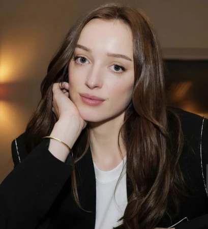 Portrait of a woman with long brown hair wearing a black blazer and white top, with make-up by Jacinta Spencer