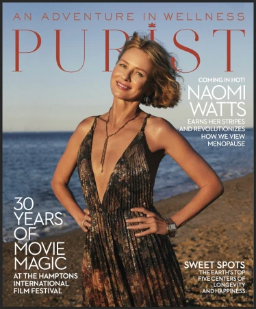 Magazine cover featuring Naomi Watts in a shimmering gown with a beach backdrop, promoting wellness and film magic.