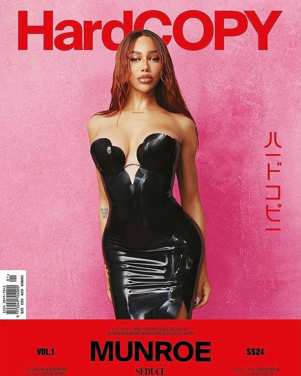 Magazine cover featuring a woman in a black dress against a pink backdrop, with red text reading 'HardCOPY' and model name 'MUNROE'.