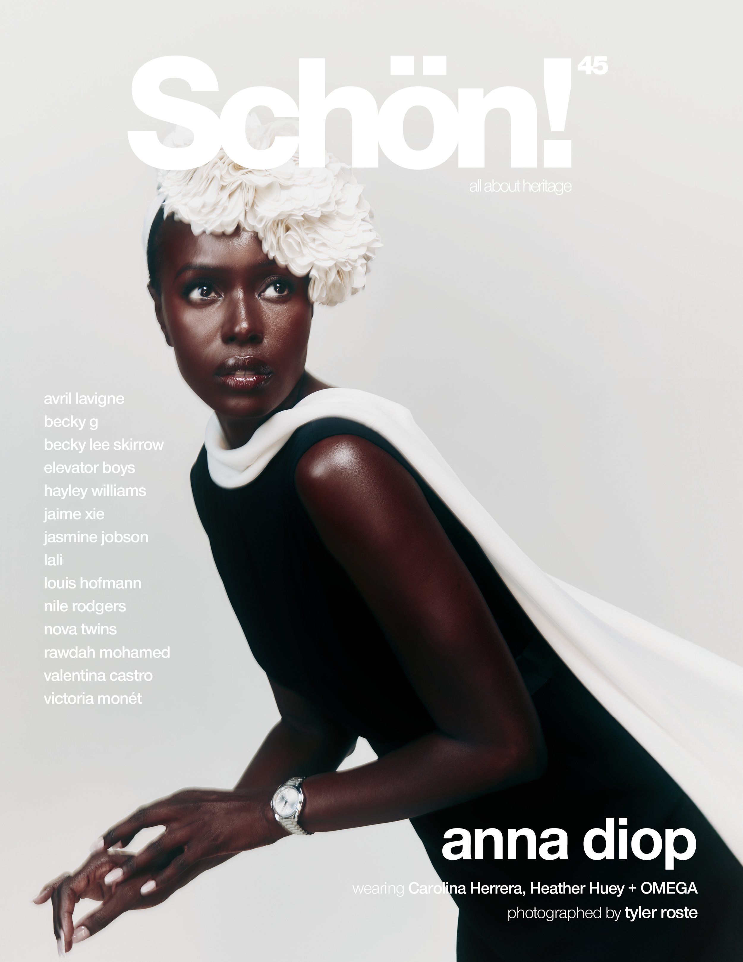 Magazine cover featuring a Black woman wearing a black dress and a white flower headpiece against a pale backdrop in a studio shot.