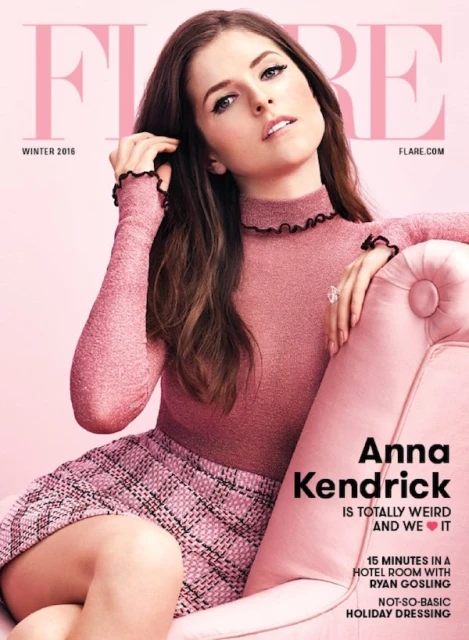 Magazine cover featuring Anna Kendrick in pink, seated on a pink tufted chair against a pink background. She wears a pink turtleneck sweater and skirt.