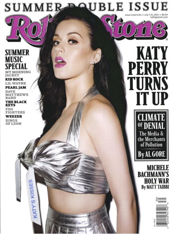 Katy Perry on the cover of Rolling Stone magazine, wearing a metallic silver top and skirt, summer double issue, music special.