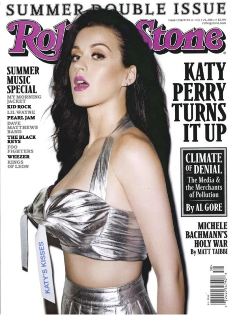 Katy Perry on the cover of Rolling Stone magazine, wearing a metallic silver top and skirt, summer double issue, music special.