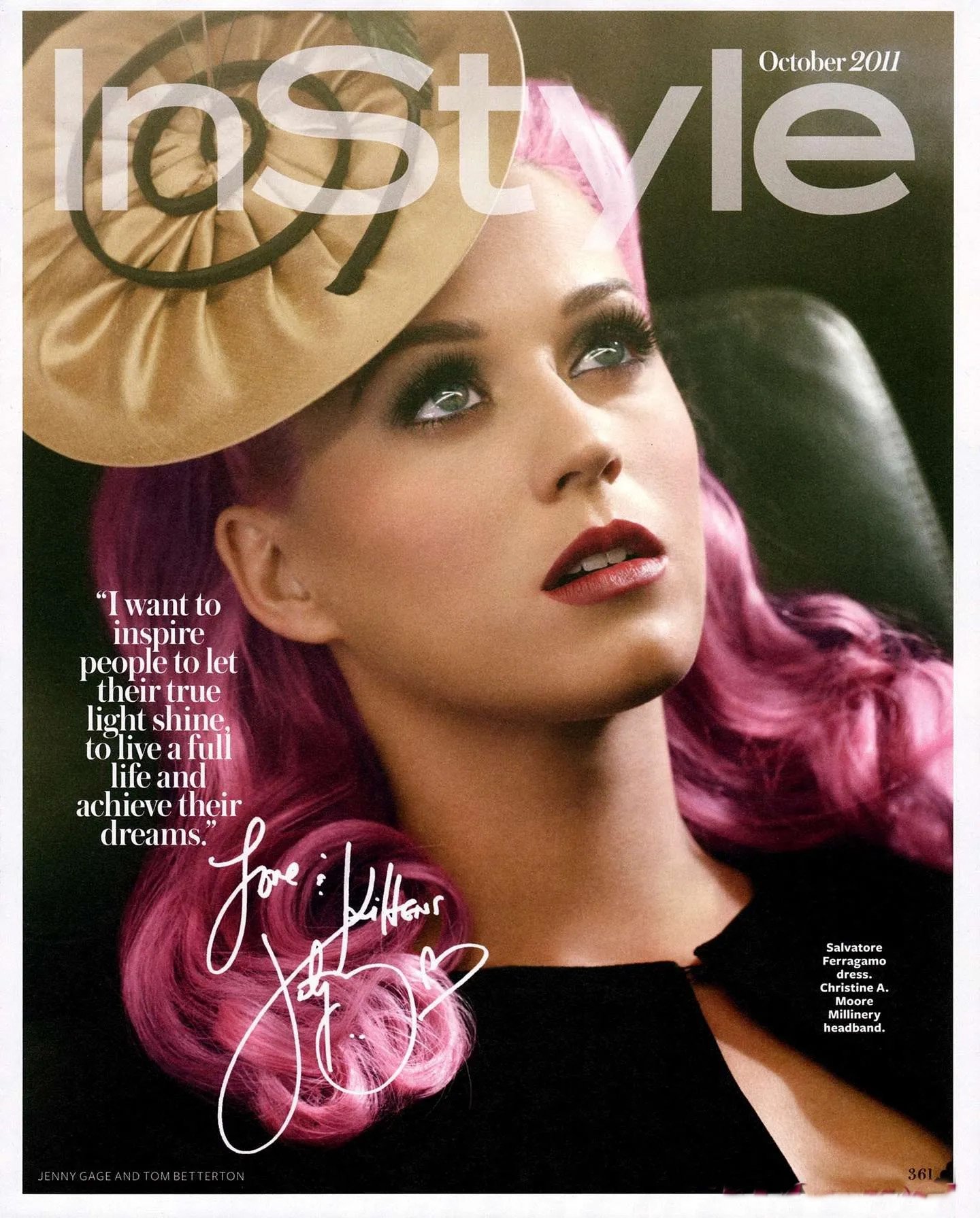 Close-up of a fair-skinned woman with pink hair wearing a tan hat, posing for the InStyle magazine cover October 2011 issue.