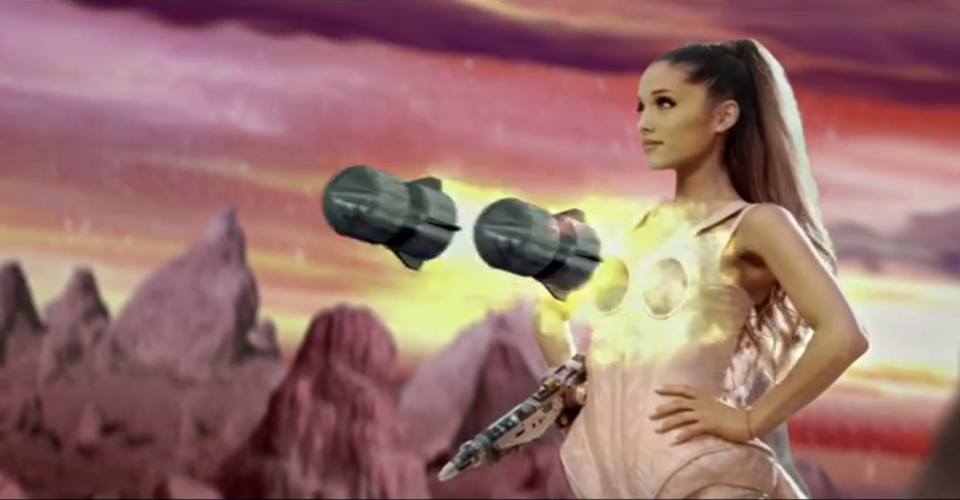 Ariana Grande in a futuristic setting with floating metallic objects, set against a stylized pink and orange sky and rocky landscape.