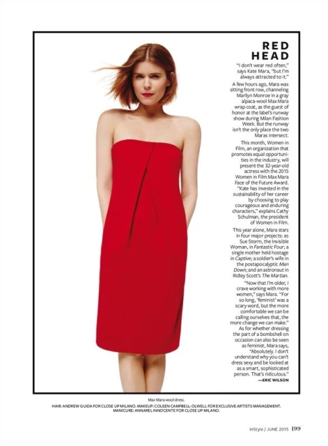 Kate Mara poses in a red, strapless dress against a white backdrop, as seen in a fashion magazine editorial layout.