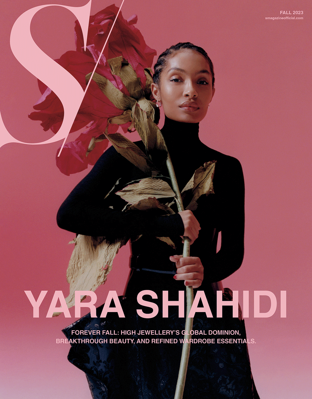 Yara Shahidi poses on a pink magazine cover with a large pink S and holds a dried rose in front of a black turtleneck top and skirt.