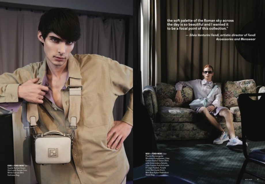 Two young adult male fashion models showcase Fendi menswear. One poses in a tan suit with a white handbag, while the other relaxes on a floral couch.