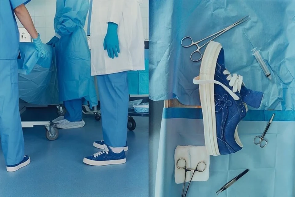 Studio shot featuring a blue sneaker with flower detail alongside surgical tools, against a matching blue surgical drape background.