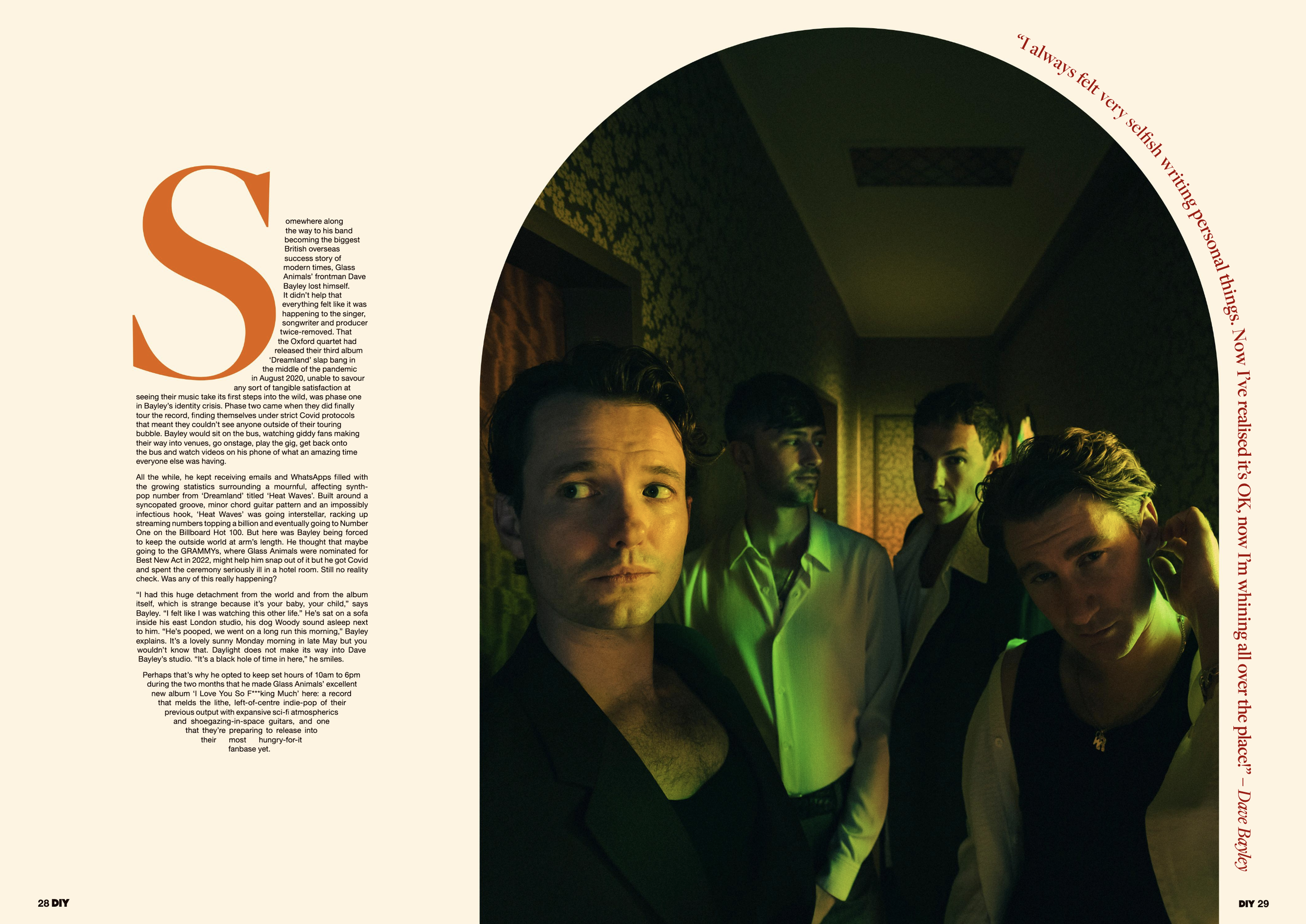 Band members from The Oxford, a British indie rock band, stand together in a dimly lit hallway with warm, green lighting for a promotional shoot.