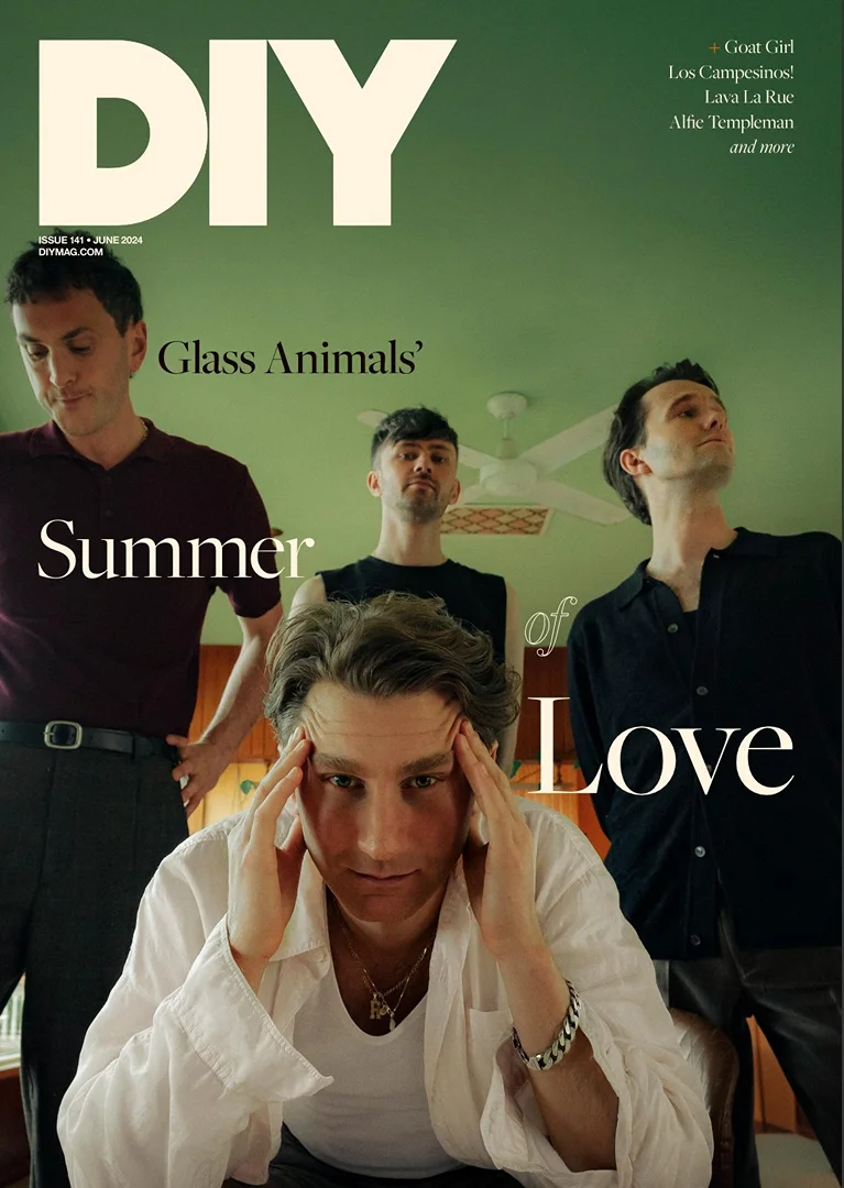 Magazine cover featuring the band Glass Animals, with four male adults in a shallow depth-of-field shot, styled with summer theme.