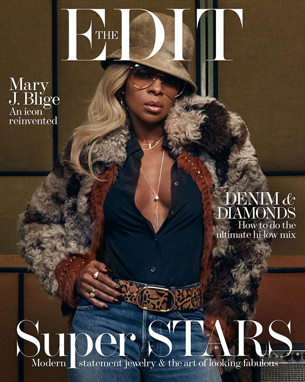 Mary J. Blige on the cover of The Edit magazine. She is wearing a fur coat, sunglasses, jeans, jewelry and a hat in a studio.