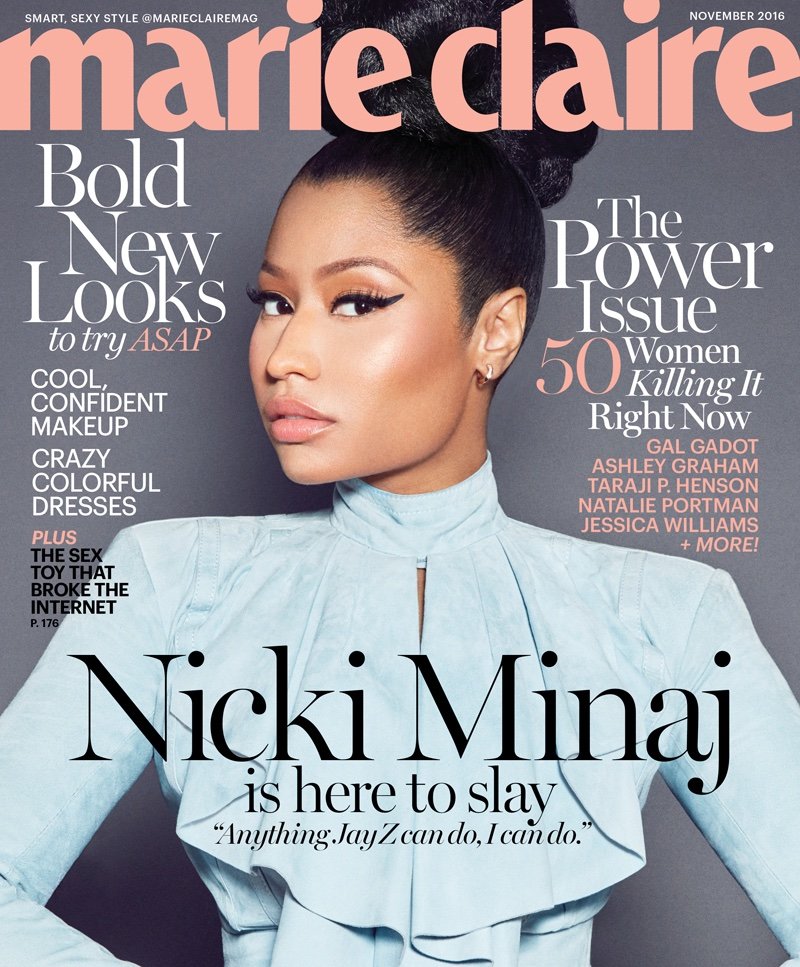 Magazine cover featuring Nicki Minaj wearing a light blue top, with magazine text overlay. Cropped view of the singer on a gray background.