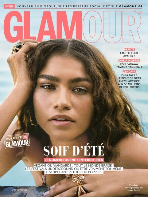 Glamour magazine cover featuring Zendaya with summer theme, bright lighting, and bold typography, showcasing fashion and beauty.