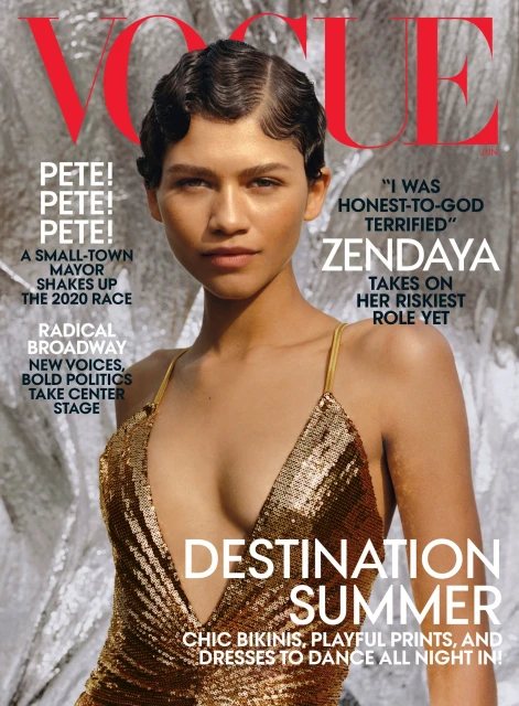 Magazine cover featuring Zendaya in a gold dress, with Vogue masthead, text headlines, and a silver textured background. Close-up portrait.