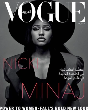 Vogue Arabia magazine cover featuring Nicki Minaj in a black hat and blazer, looking directly at the camera against a gray background.