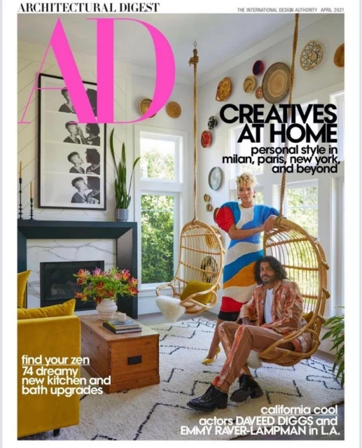 Architectural Digest cover featuring Daveed Diggs and Emmy Raver-Lampman in a stylish living room with hanging chairs and eclectic decor.
