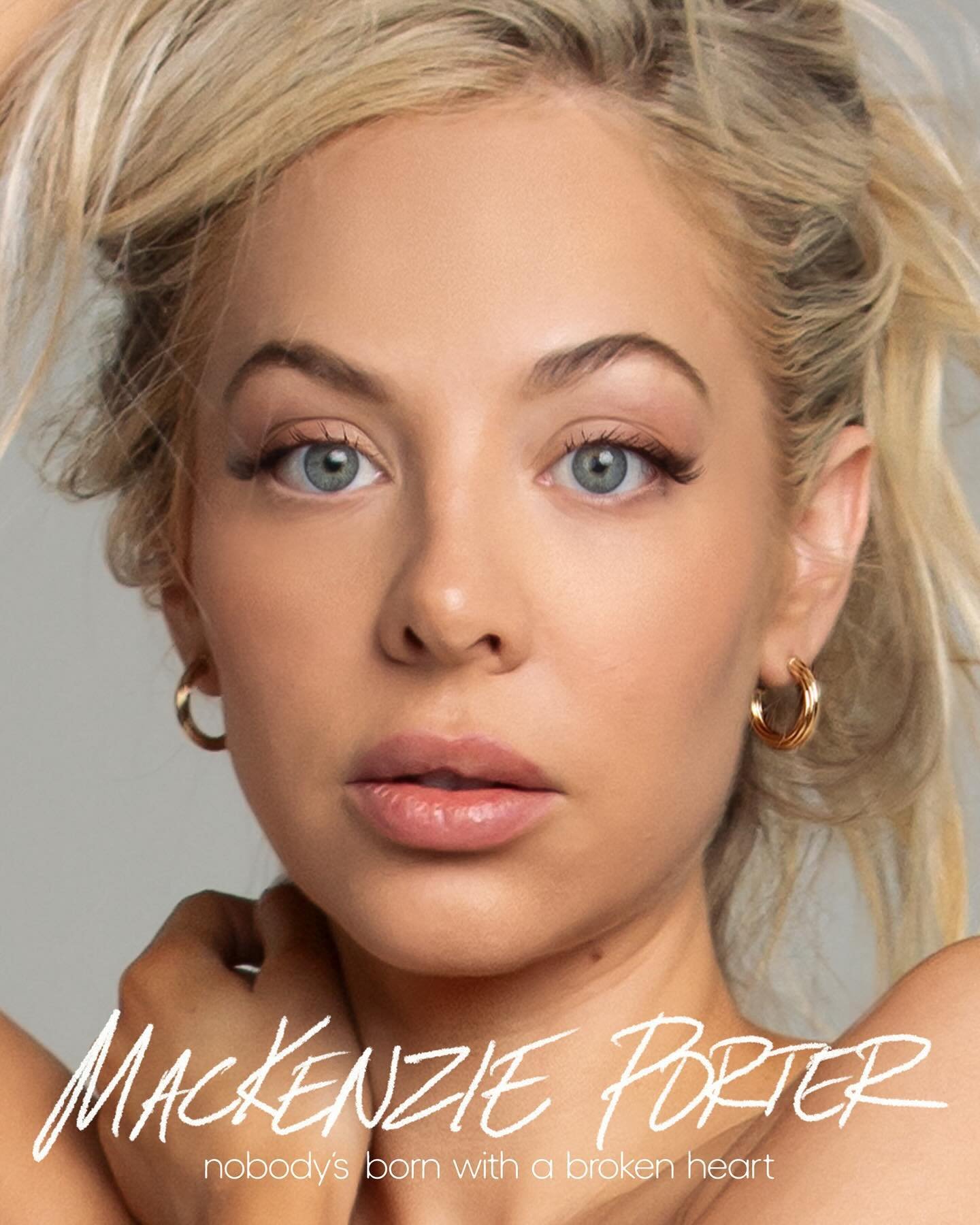 Close-up portrait of a blonde woman with blue eyes wearing gold hoop earrings, with text overlay on the bottom of the image.