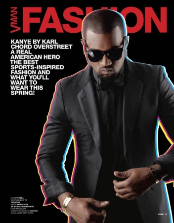 VMAN Fashion magazine cover featuring Kanye West wearing a black suit and sunglasses against a dark background with colorful text.