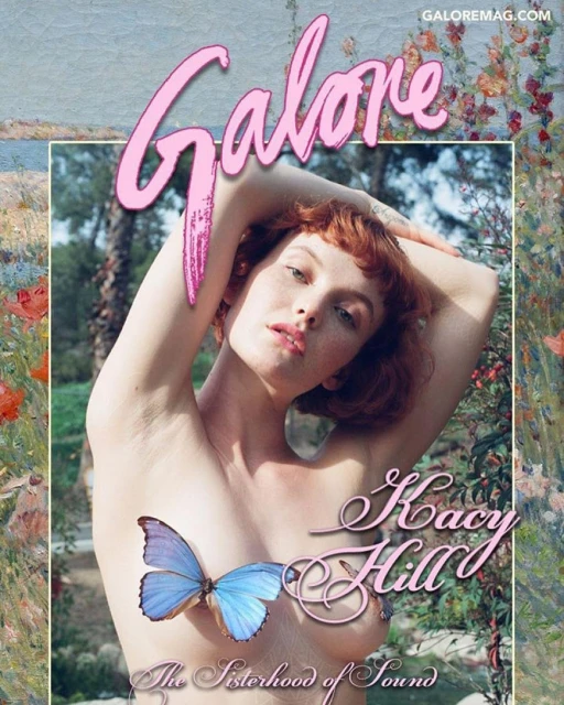 Portrait of a redhead woman with a butterfly covering her chest, posing outdoors with artistic floral backgrounds and Galore magazine logo.