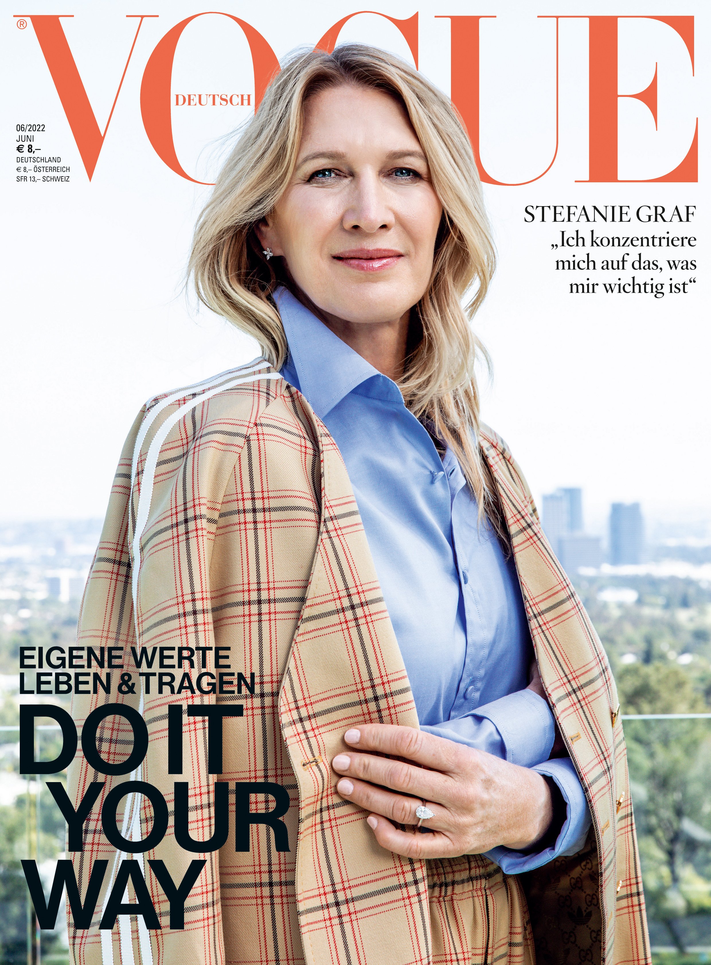 Vogue cover featuring Stefanie Graf in a tan plaid blazer and light blue shirt against a soft outdoor background.