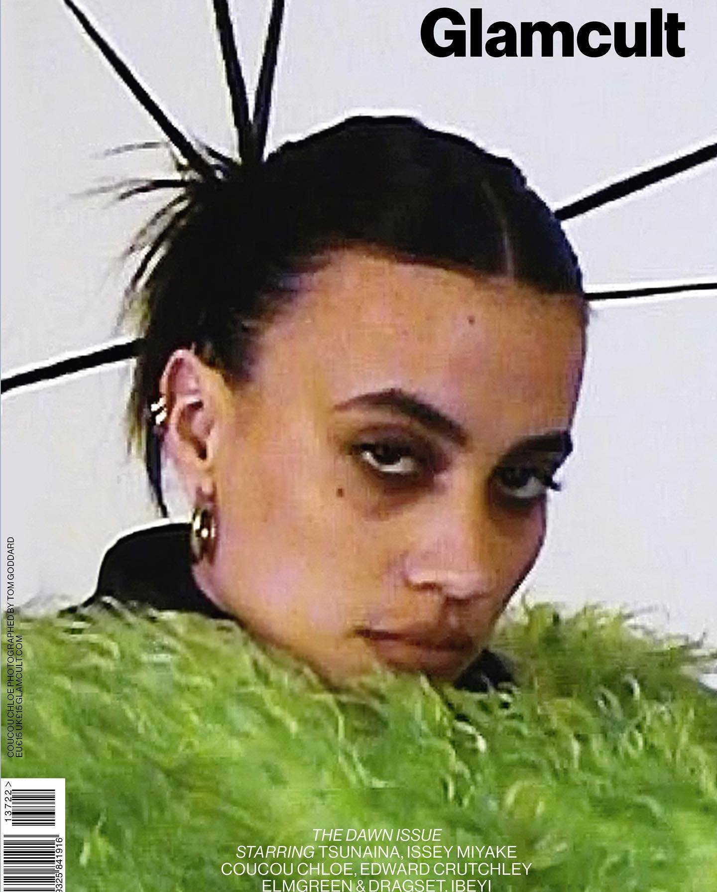 Glamcult magazine cover featuring a woman with dark hair and a green faux fur stole, shot in a photo studio with soft lighting.