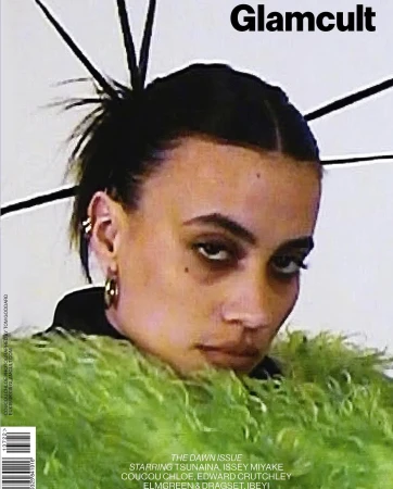 Glamcult magazine cover featuring a woman with dark hair and a green faux fur stole, shot in a photo studio with soft lighting.