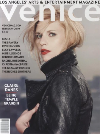 Magazine cover featuring actress Claire Danes wearing a black leather jacket against an urban skyline background.
