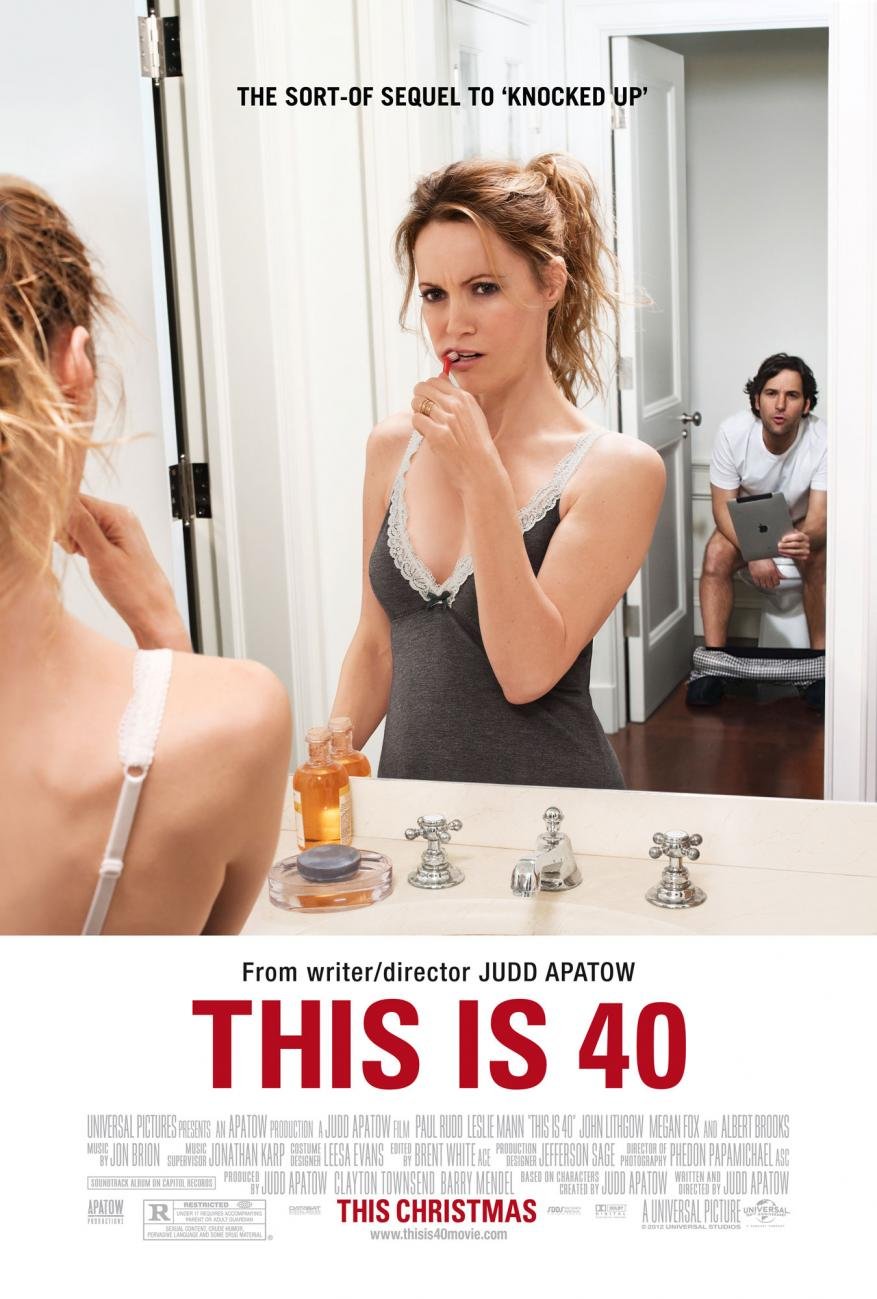 A woman in bathroom mirror with toothbrush while a man sits on the toilet in the background in this movie poster for This is 40.