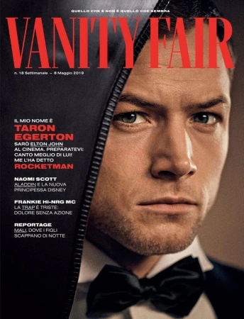 Vanity Fair magazine cover featuring Taron Egerton in a close-up shot, wearing a bow tie with partial black leather jacket.