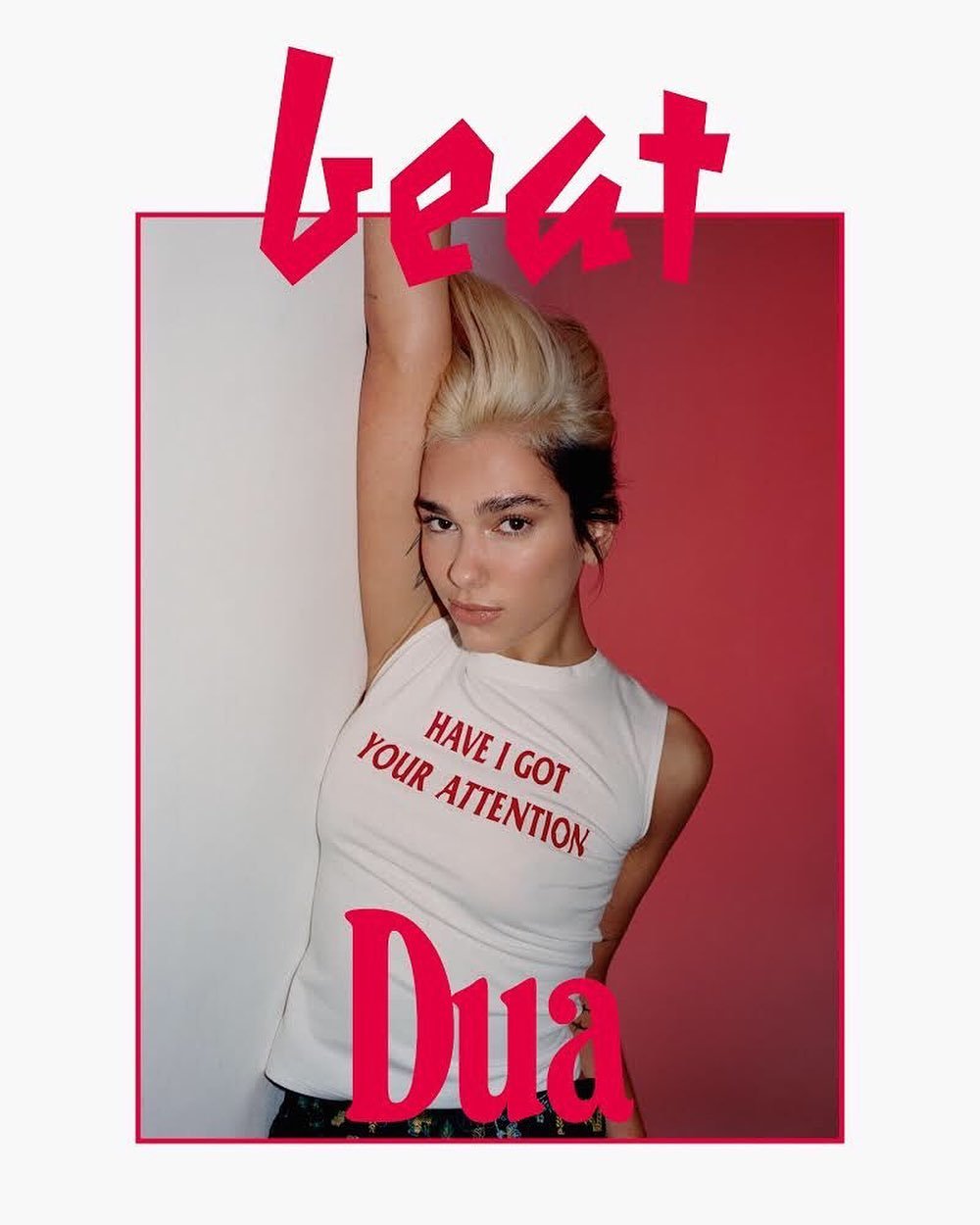 Blonde woman posing in front of red and white wall with text overlay in fashion style for commercial advertising or editorial.