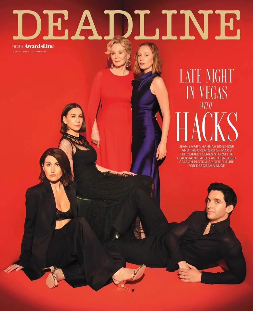 Magazine cover featuring the cast of 'Hacks' on a red background. Actresses are wearing formal dresses and suits in black, red, and purple.