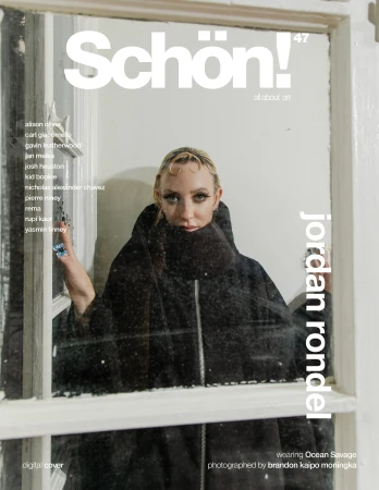 Schön! magazine cover featuring Jordan Rondel in a black hooded coat framed by a window, with white text and a minimalist aesthetic.