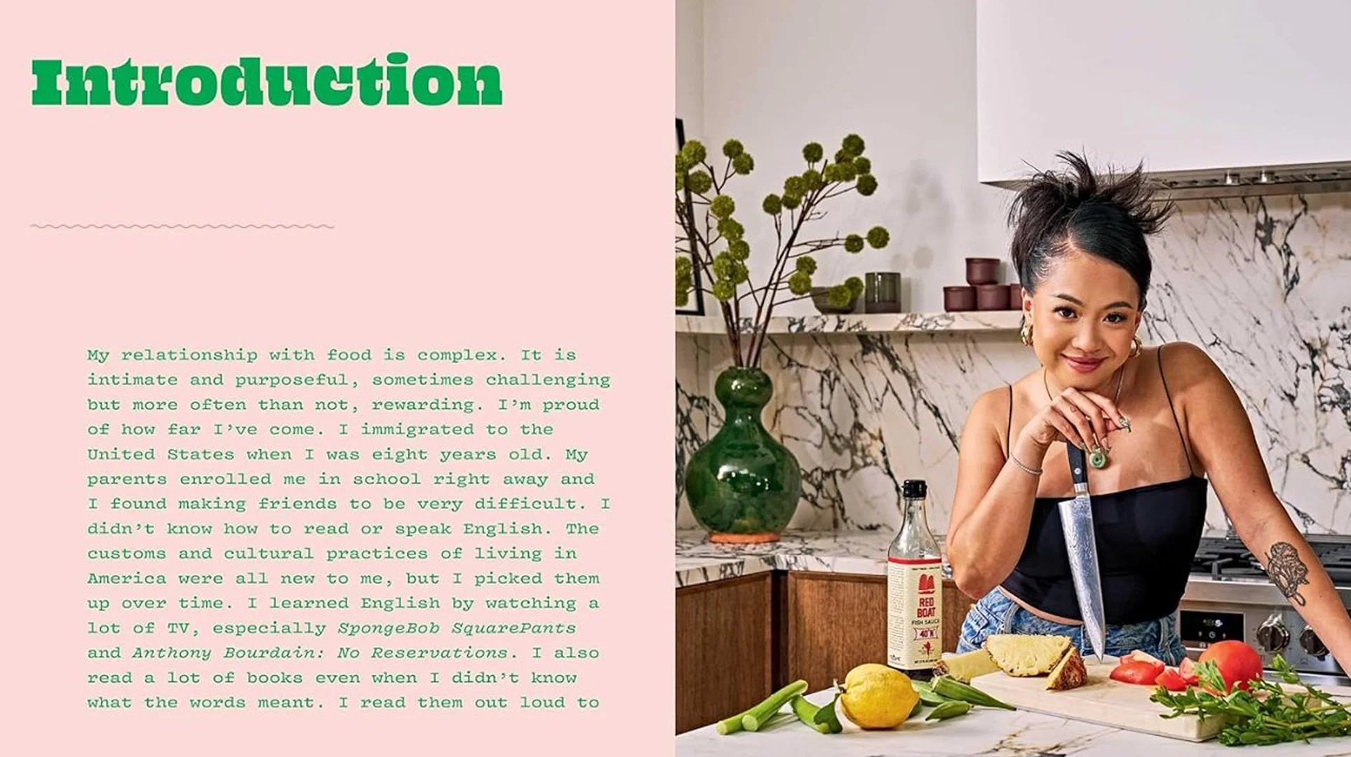 Smiling woman in kitchen preparing vegetables with knife, marble countertop, indoor plant, and natural light.