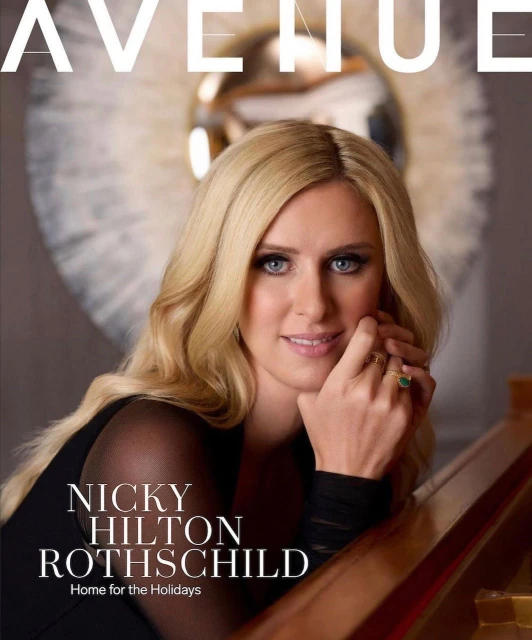 Magazine cover featuring a portrait of Nicky Hilton Rothschild, blonde hair, dark dress, jewelry, and elegant background.
