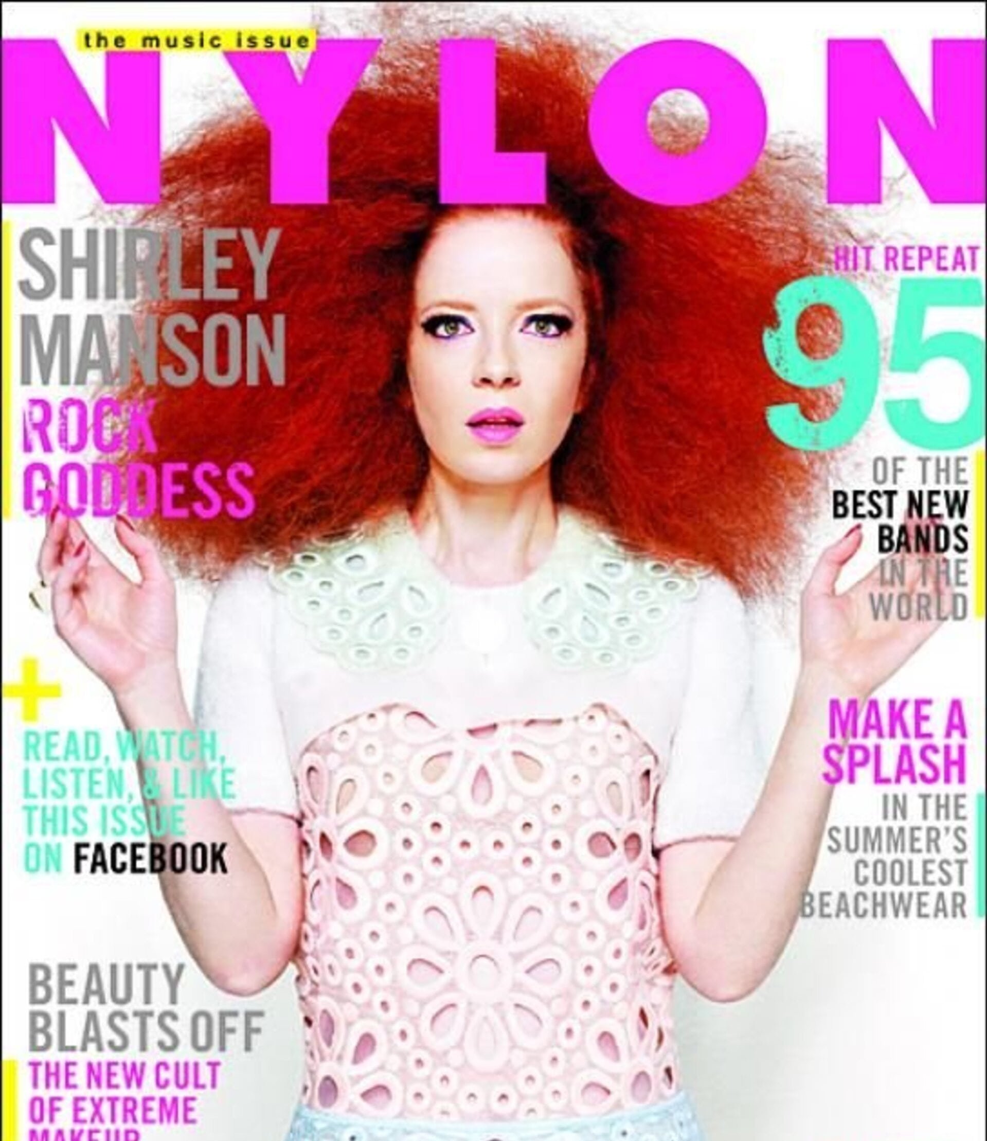 Shirley Manson magazine cover. The woman with striking red hair and pink makeup gazes at the camera on the cover of Nylon magazine.