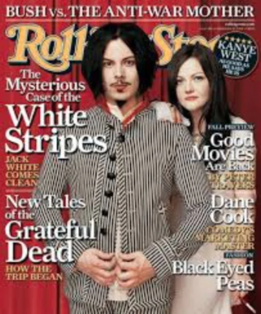 Rolling Stone magazine cover featuring Jack and Meg White of The White Stripes, in a full shot, against a red and white background with text.