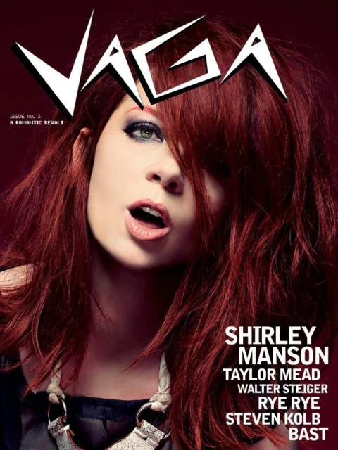 Magazine cover featuring a woman with red hair and an open mouth, with the magazine's title 'VAGA' in large white letters and other text.