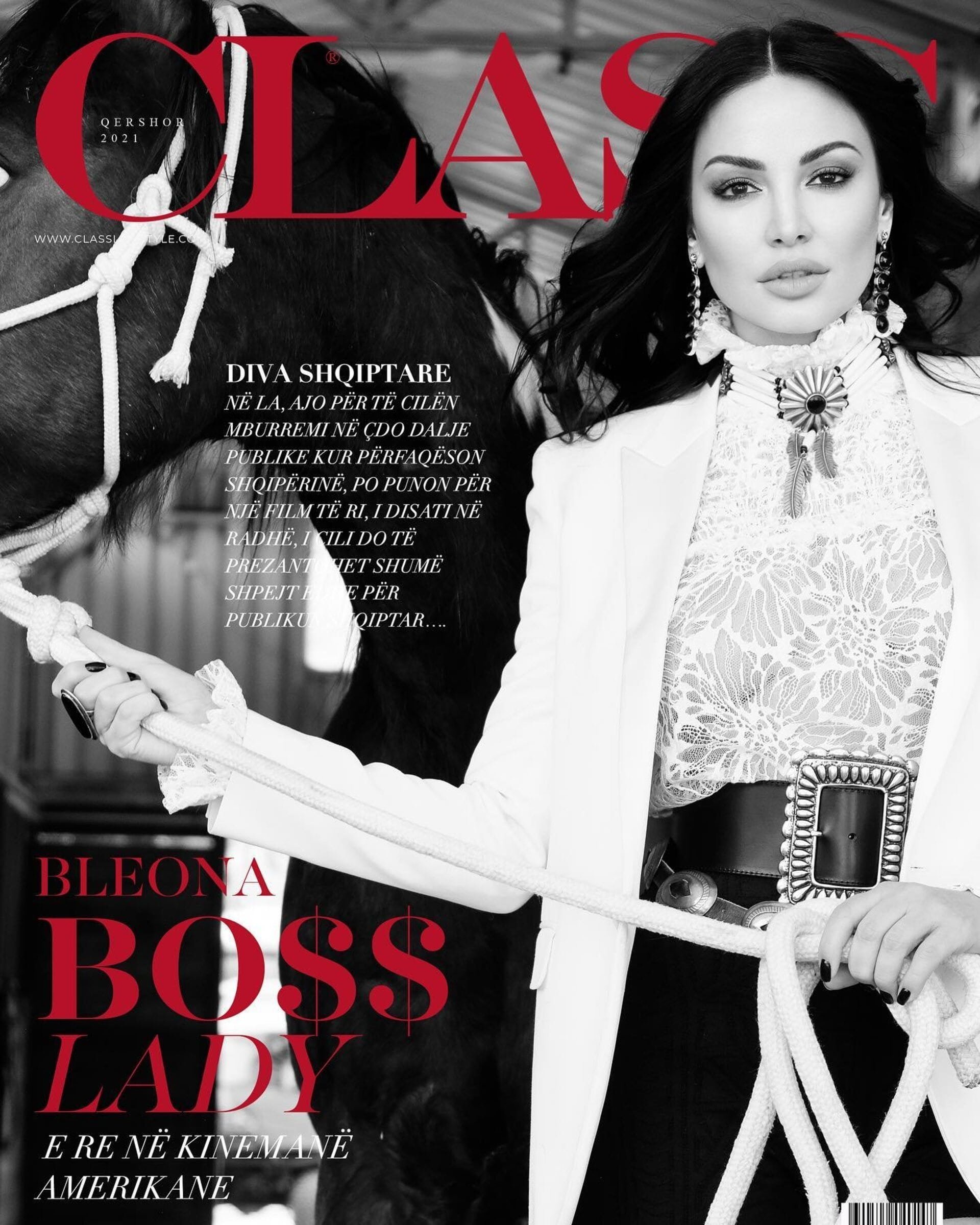 Magazine cover featuring an adult female model in a white blazer and a horse, against a black and white background with text.