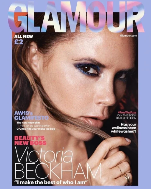 Glamour magazine cover featuring Victoria Beckham's portrait. She has smoky eye makeup and wears rings. The magazine has text headlines.