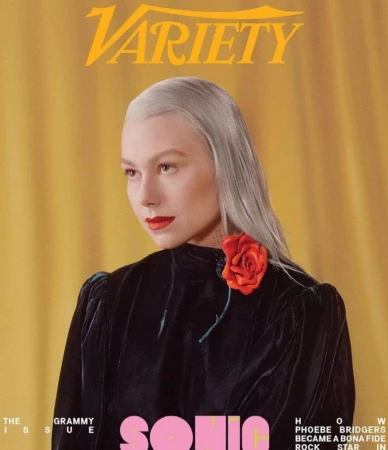 Variety magazine cover featuring Phoebe Bridgers. She wears a black velvet top with a red rose and has gray hair and red lipstick.
